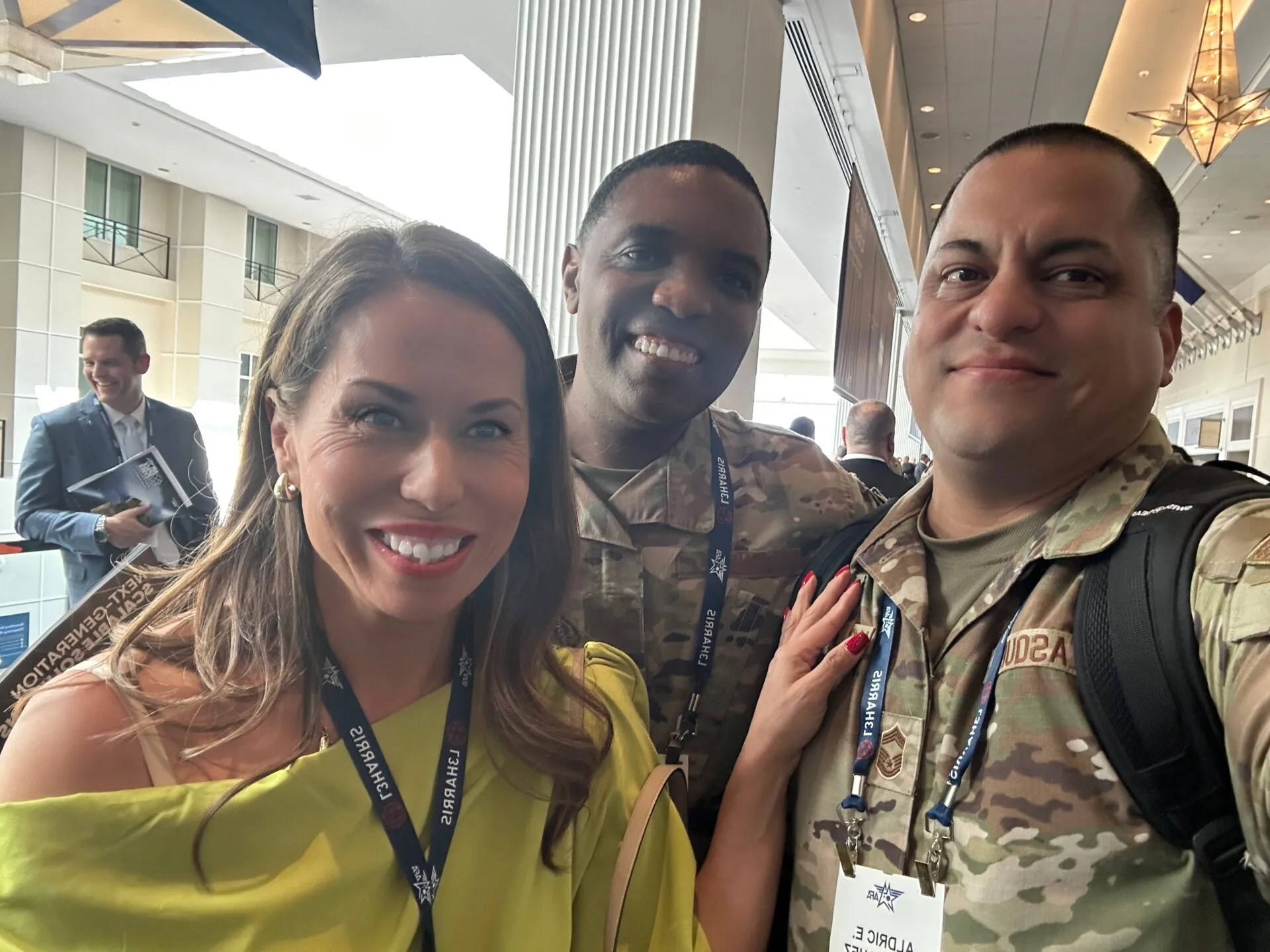 WeVett’s sles director poses with two military members during the AFAF 2025 conference