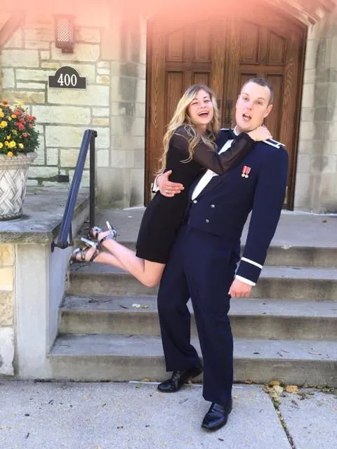 young Evan and Shannon Kaufman standing in front of a door showing how PCSing and buying a home isn’t easy without a military-friendly real estate team
